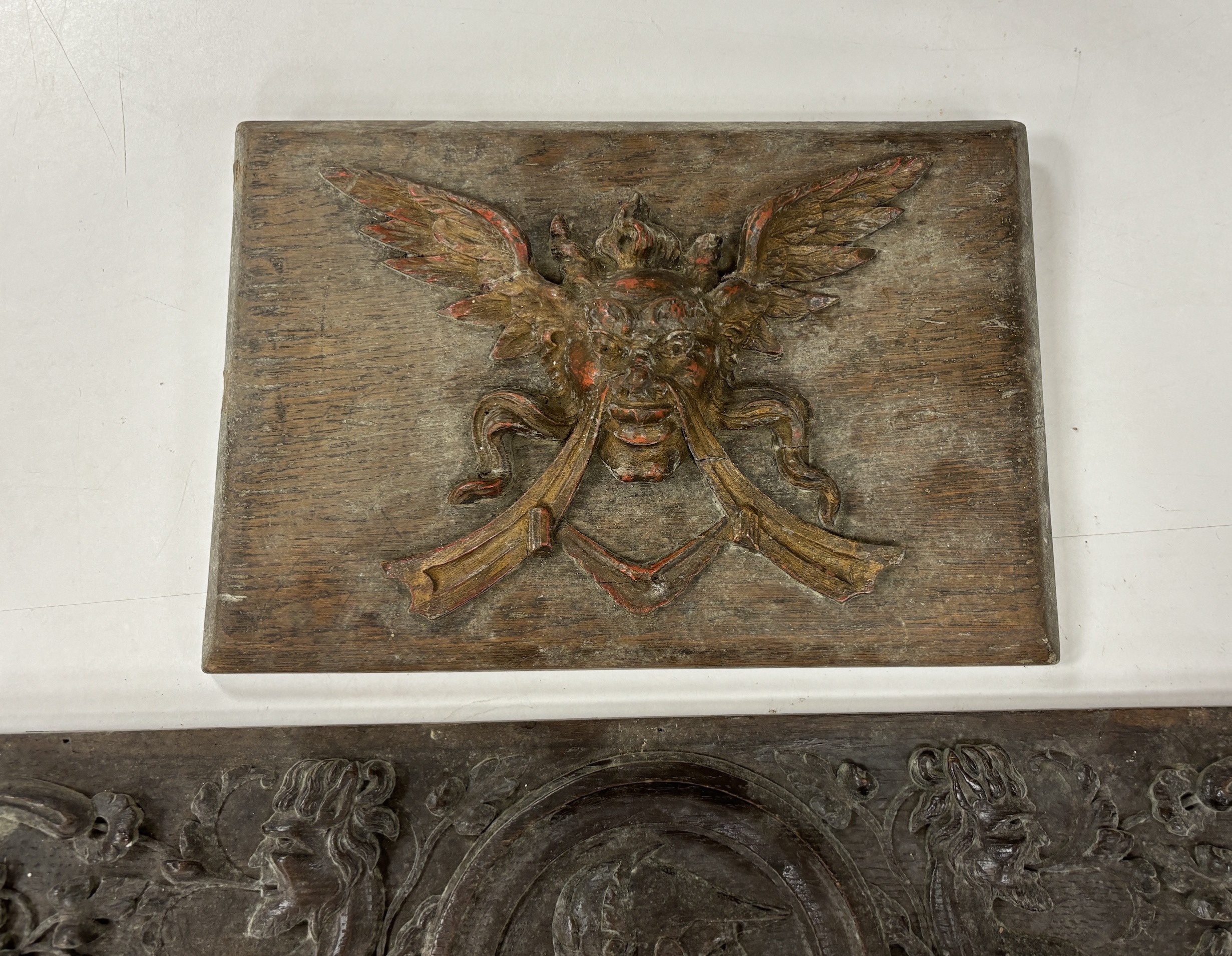 Two 18th century carved oak panels, largest 93cm wide